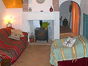 Living room with wood burning stove Rural accommodation with two bedrooms, Comares, Malaga